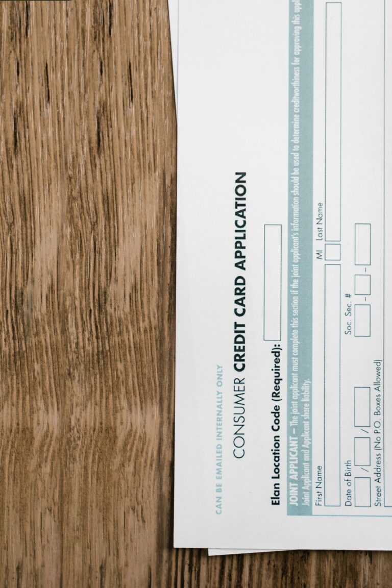 Close-up of a consumer credit application form on a wooden surface