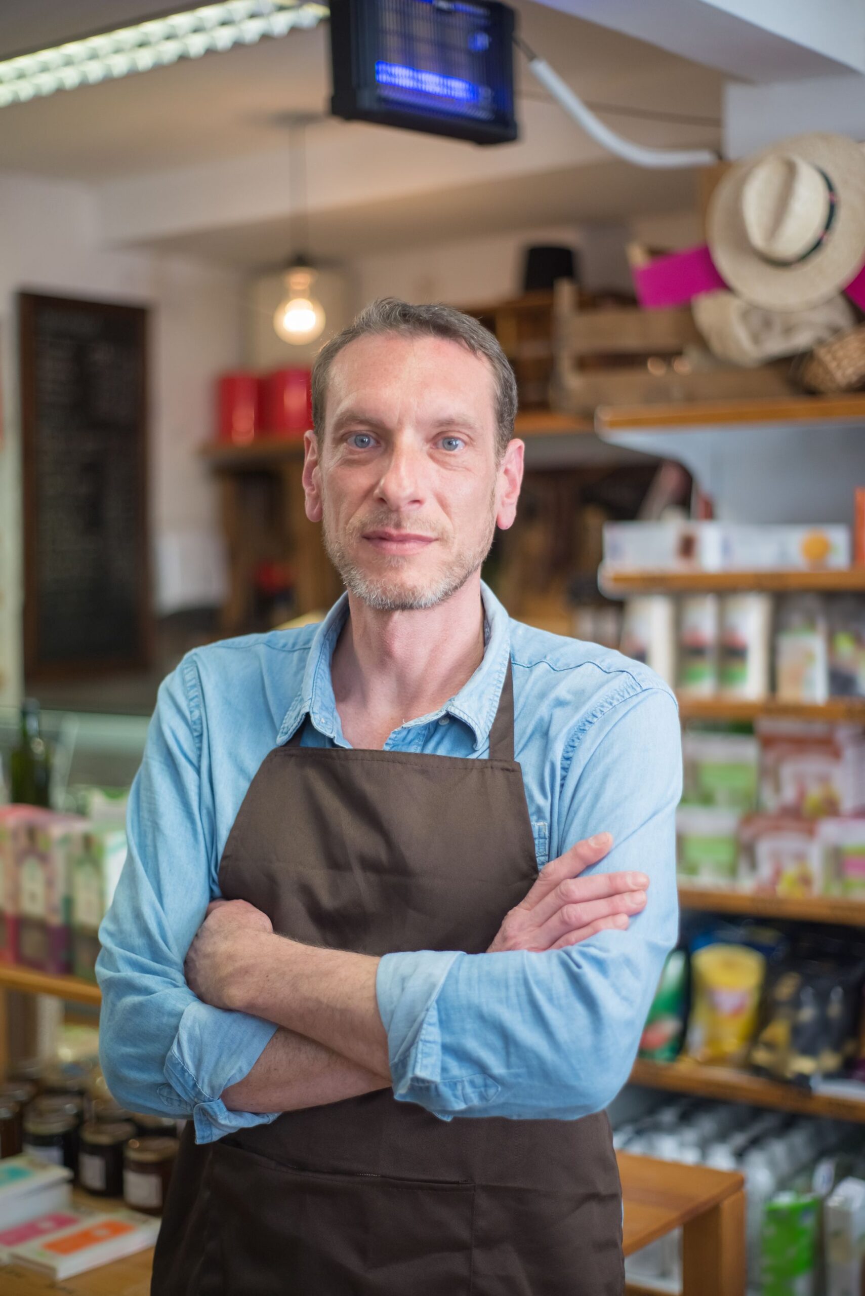 Small business owner standing in their shop