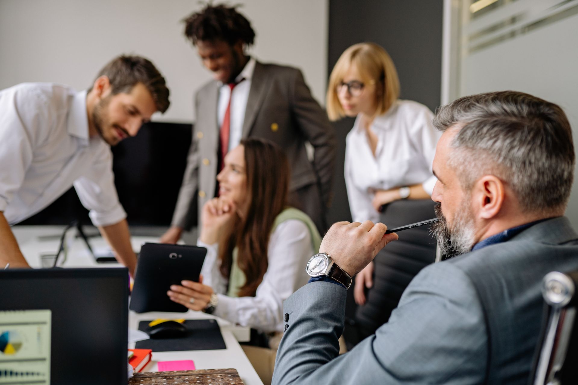 Small business team meeting around a table in an office