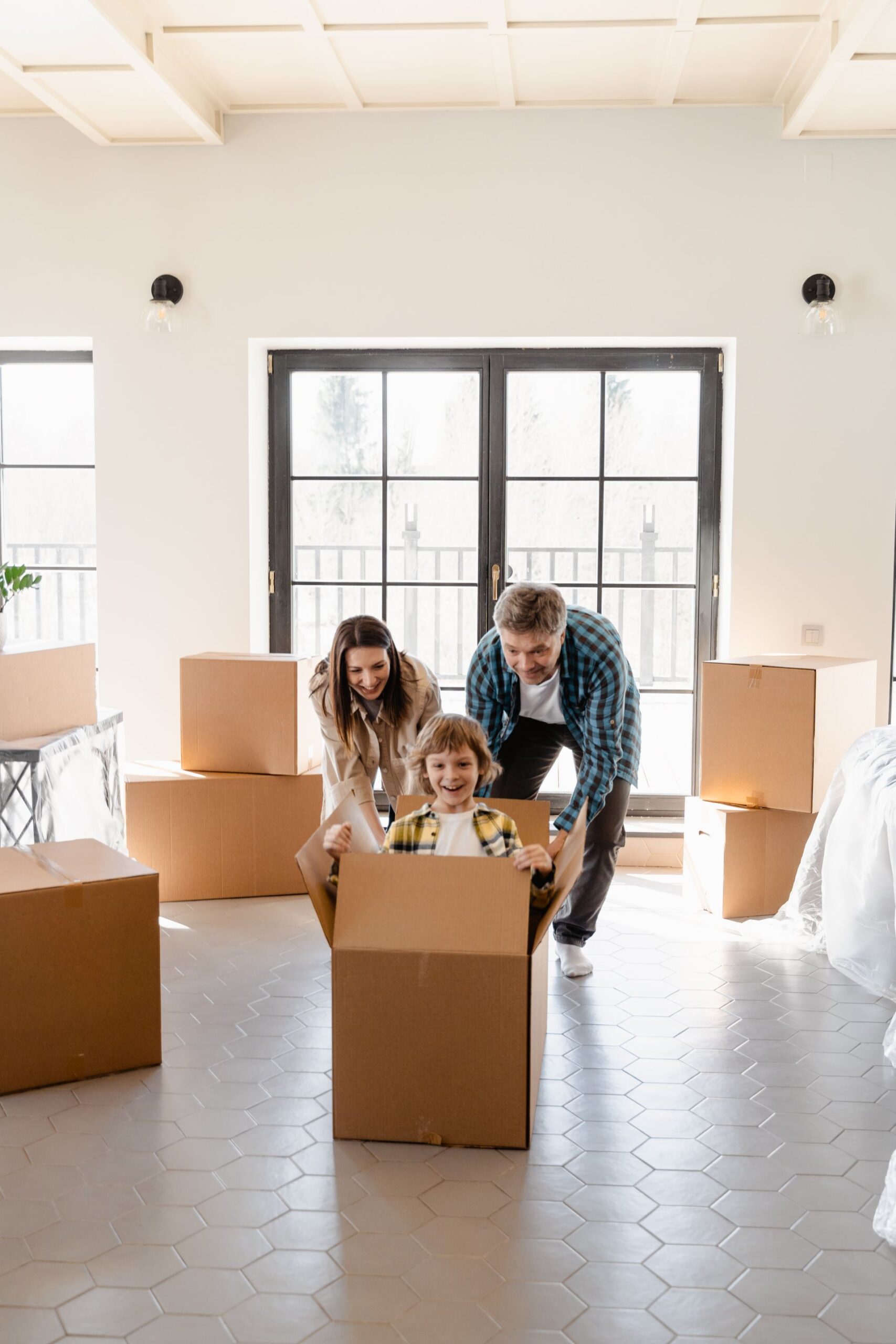 Family with moving boxes in a new home
