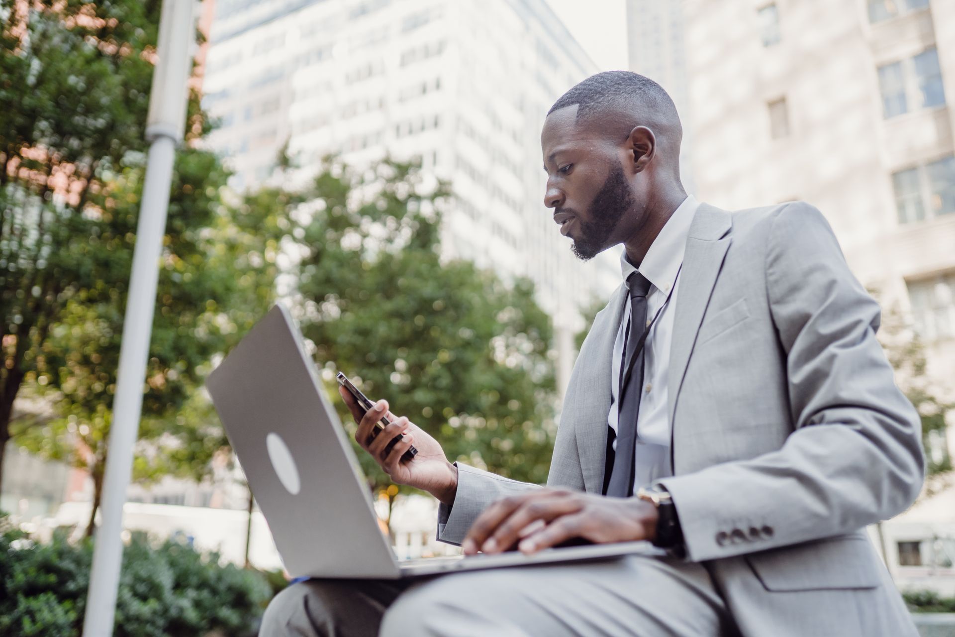 Businessman working on laptop managing business cash flow