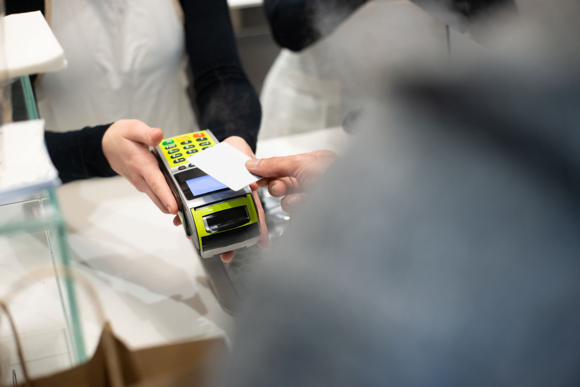Customer paying with a credit card at a store