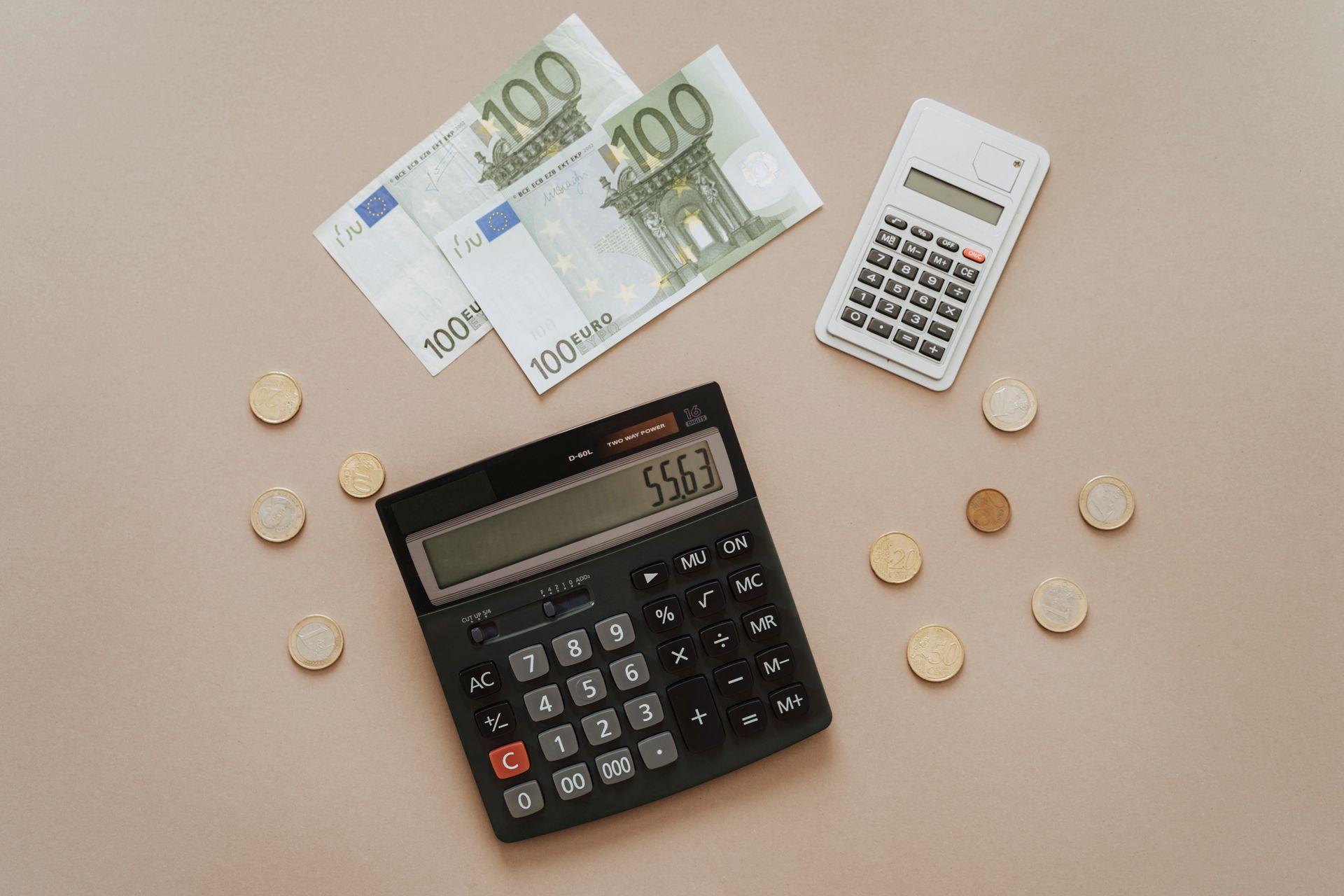 Person reviewing loan costs with calculator
