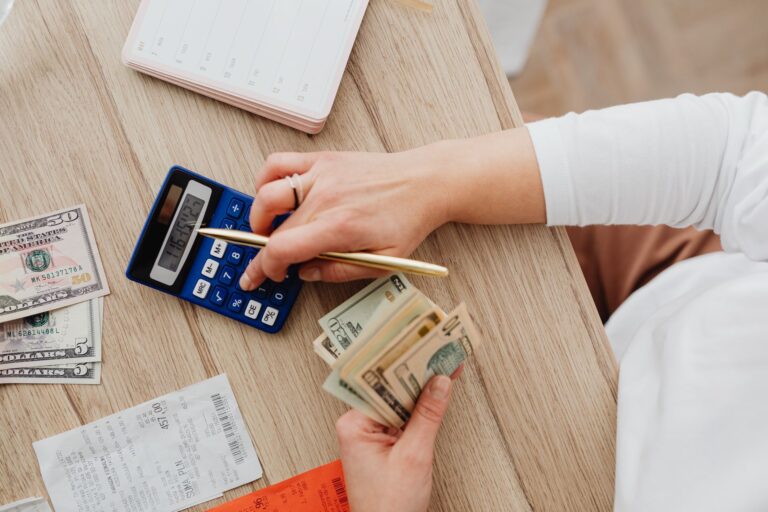 Calculator and bills for monthly budget planning
