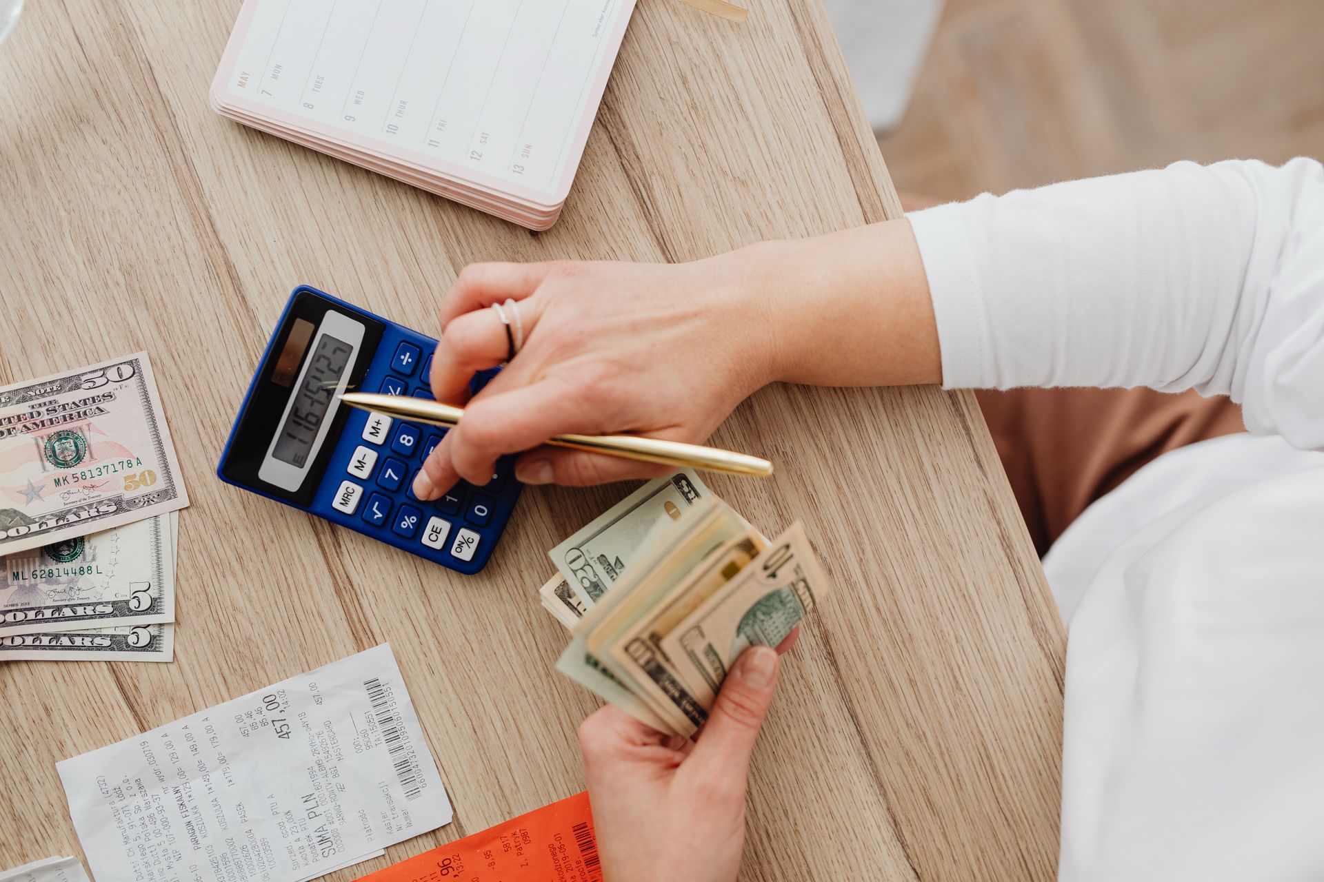 Calculator and bills for monthly budget planning