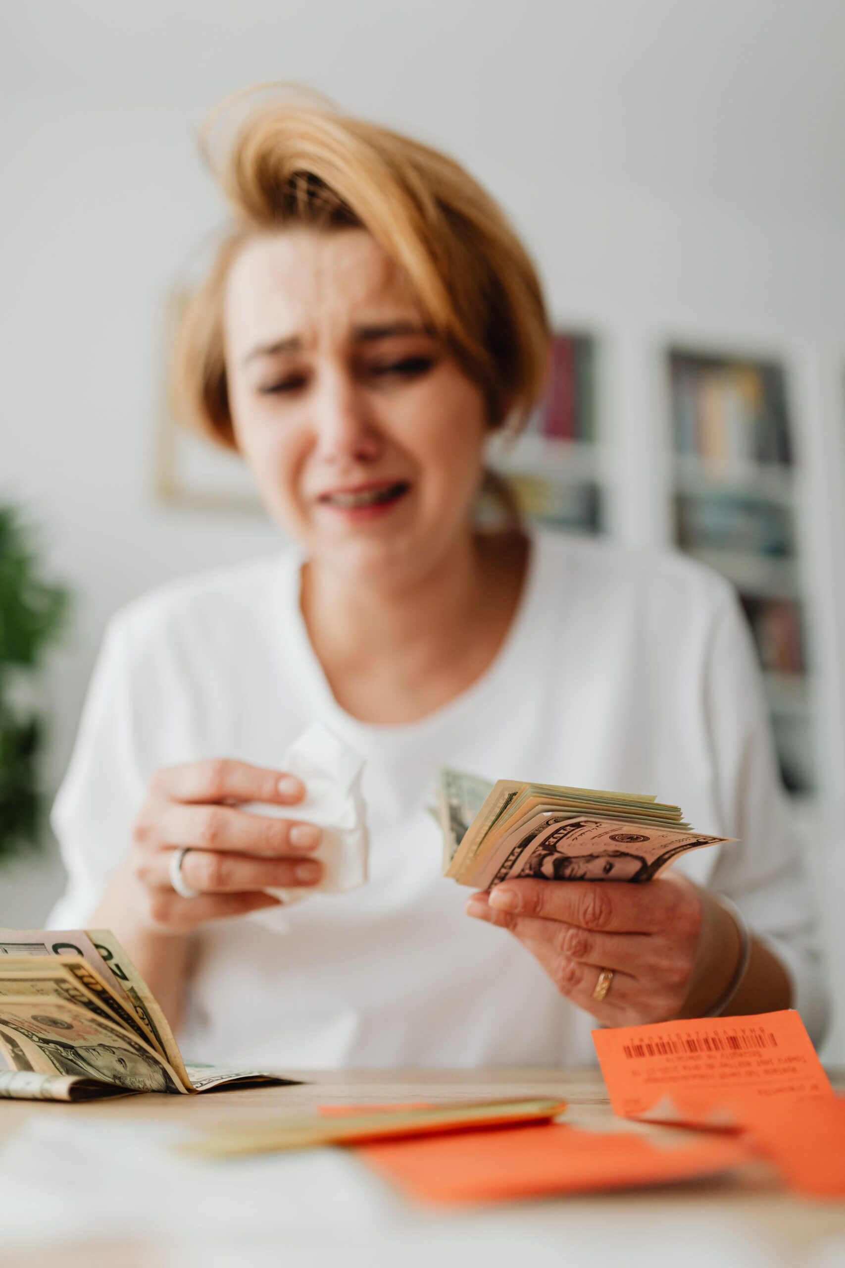 Woman managing finances and reviewing bills at home