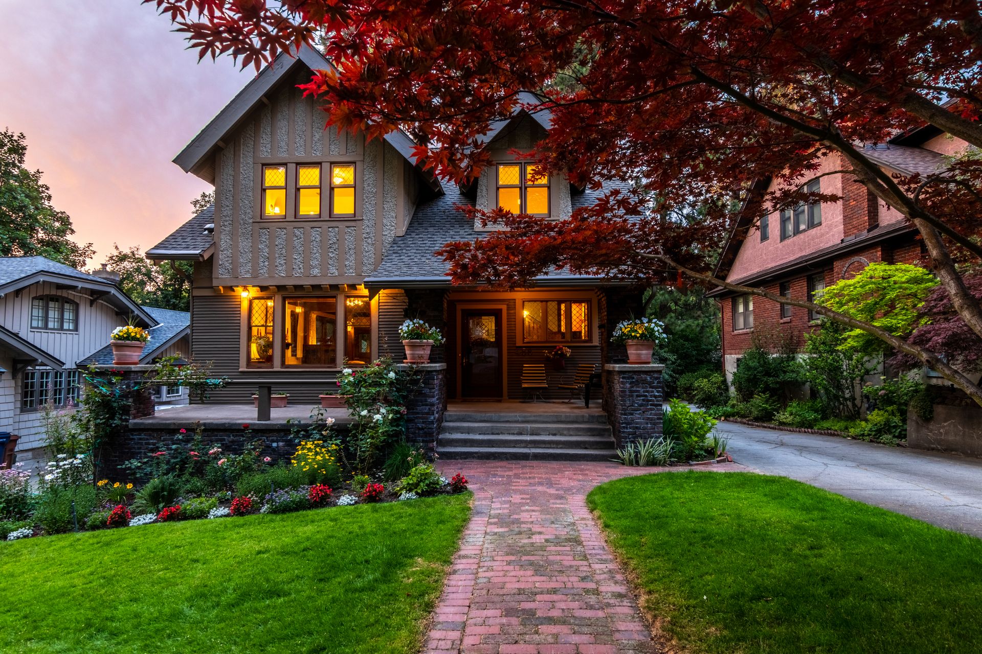 Picturesque suburban house with a garden at twilight