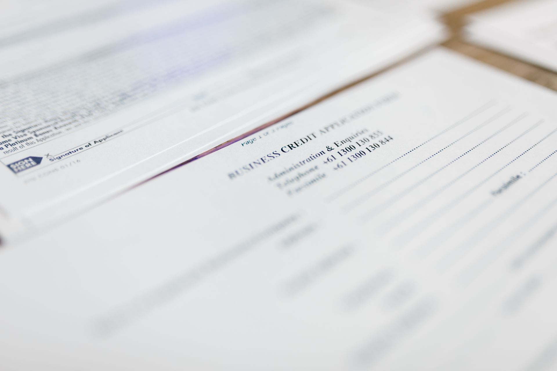 Focused image of business credit application papers